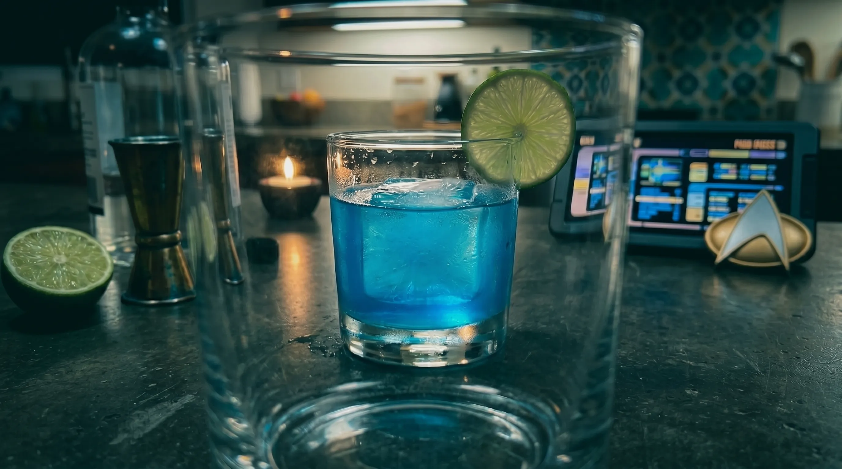 My Romulan Ale seen through another glass, blue distorted by the foreground